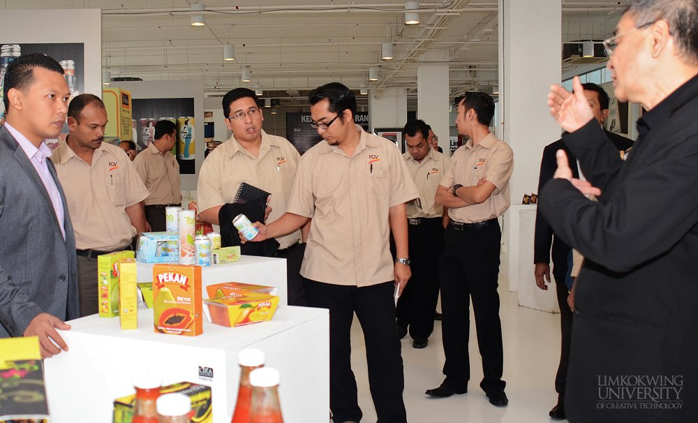 Limkokwing University Vice President, Dato’ Raja Aznil explaining the products on display at the Branding Innovation Centre.