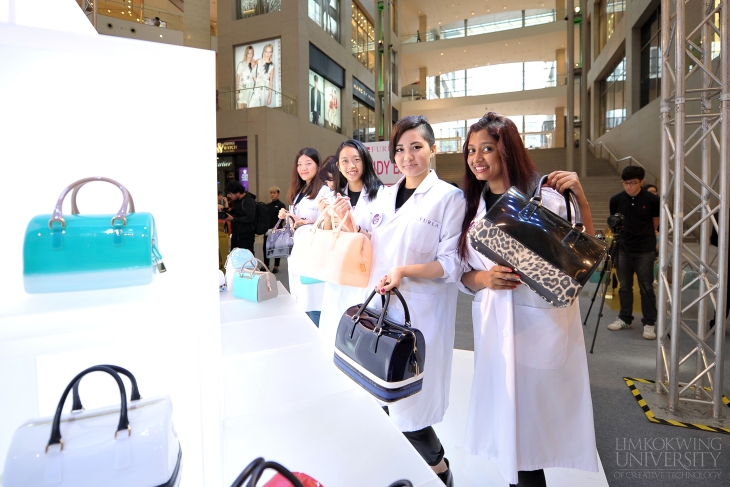 Students showing off their creations during their workshop at the Furla Candy-Brissima Tour at Pavillion KL