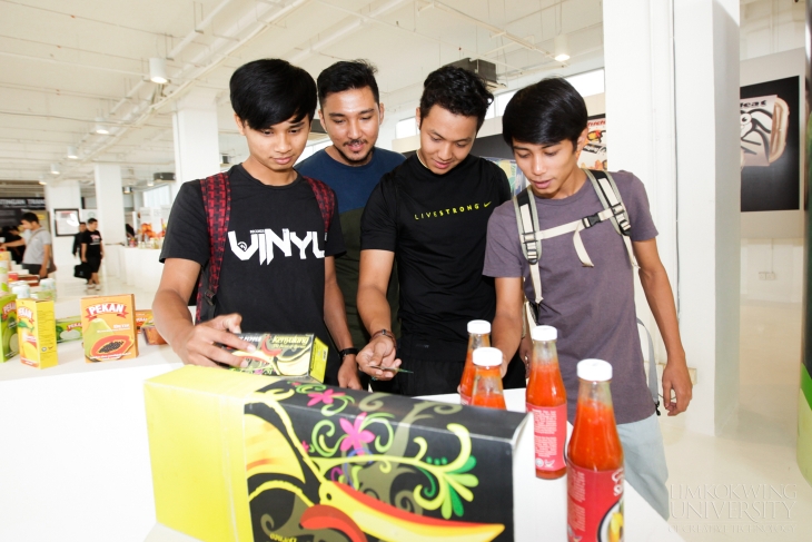 Students getting acquainted with Limkokwing University creativity at the Branding gallery.