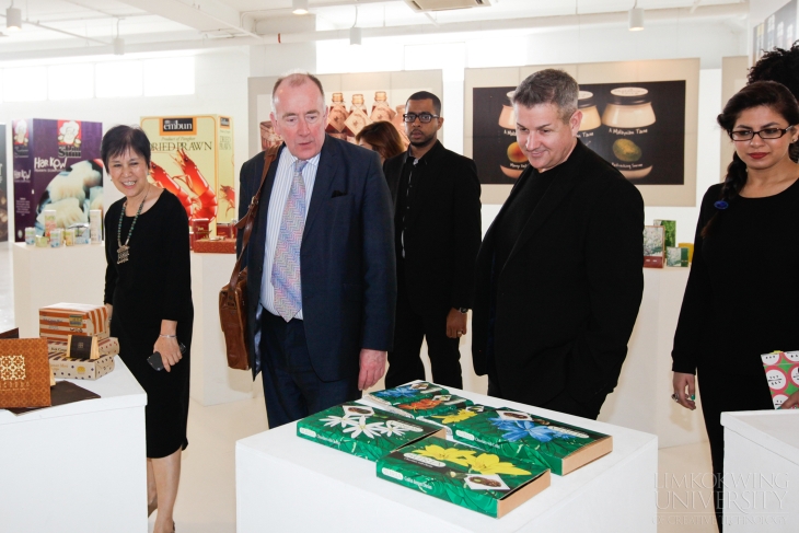 Van Gore and his group looks at the various works on display at the Branding Innovation Centre.