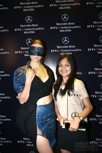 Yona with a model showing her recycled material dress