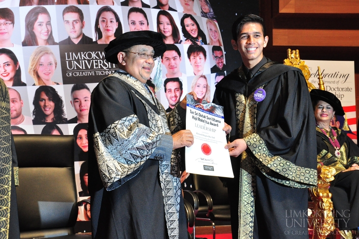 One of the award winners receiving his certificate