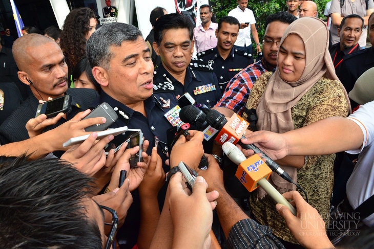 Tan Sri Khalid talking to the media