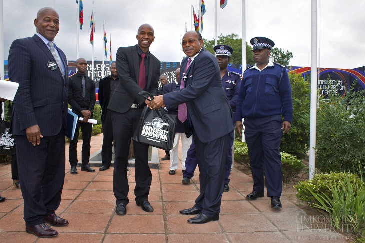 Deputy Prime Minister; Honorable Paul Dlamini receiving a token of appreciation from the University