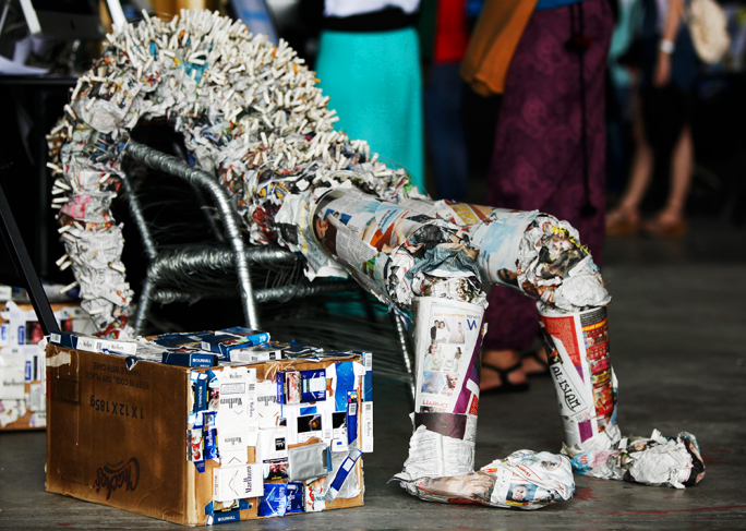 A Mystique 3D installation made of cigarette butts and newspapers.