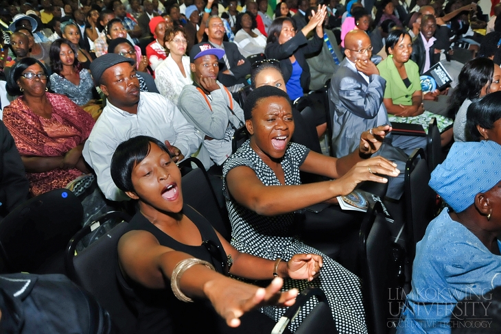 The crowd cheering for the graduates