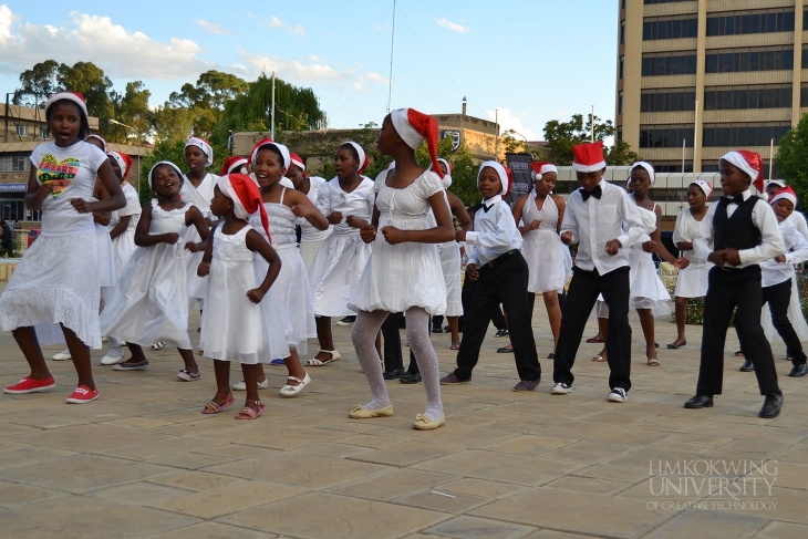 Children dancing during the tree lighting cremony