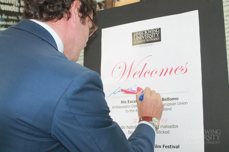 H.E Nicola Bellomo signing the welcome board