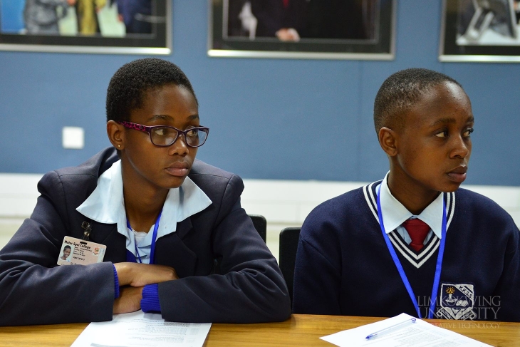 Students listening to the presentations