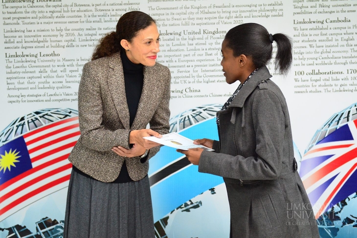 Mrs Renee Eisen Khonat, BSA Executive Secretary, awarding certificate to one of the students